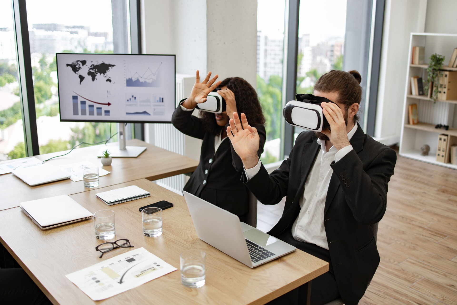 Business professionals using virtual reality in modern office